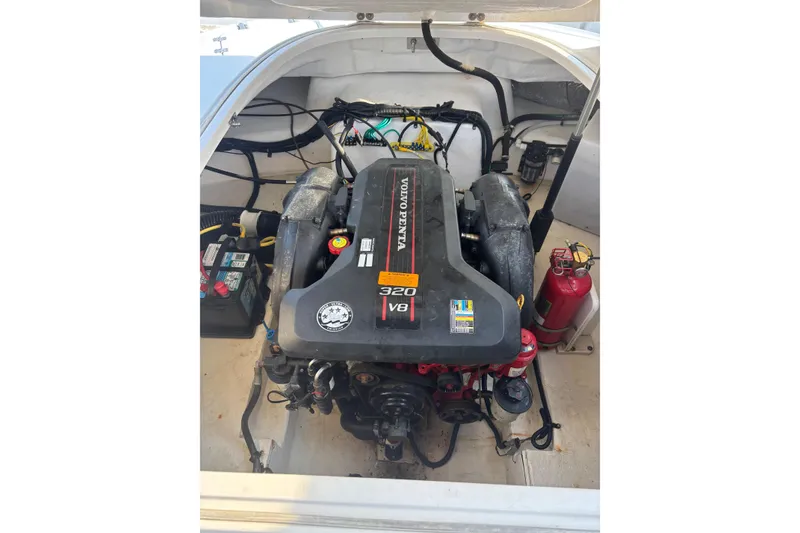 Slide: The Image of 2012 Chaparral 267 SSX boat engine compartment with Volvo Penta 320 V8 engine. - 7
