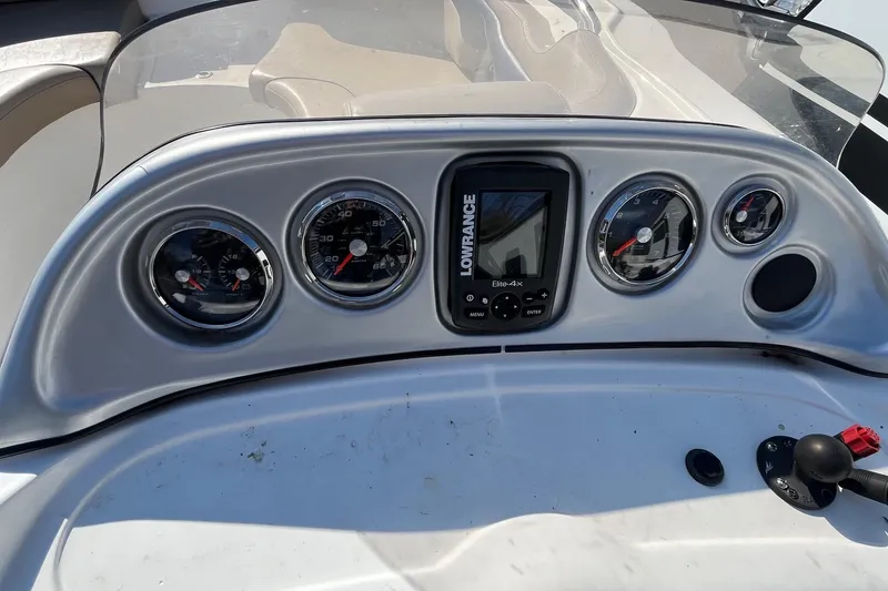 Slide: The Image of Dashboard of 2013 Hurricane SunDeck Sport 203 OB boat with gauges and Lowrance device. - 13