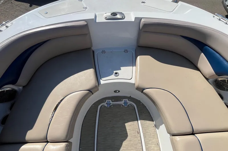 Slide: The Image of 2013 Hurricane SunDeck Sport 203 OB boat interior with beige and blue seating. - 18