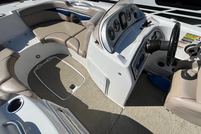 Slide: The Image of 2013 Hurricane SunDeck Sport 203 OB boat interior with seating and control panel. - 7