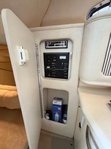 Slide: The Image of Interior of 2000 Sea Ray Sundancer 260 featuring control panel. - 6