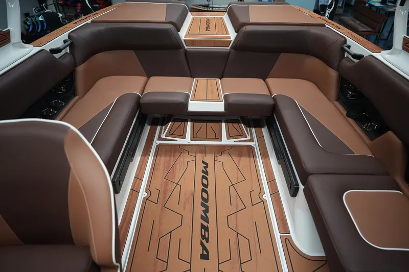 Slide: The Image of Interior of 2026 Moomba Craz with brown leather seating. - 10