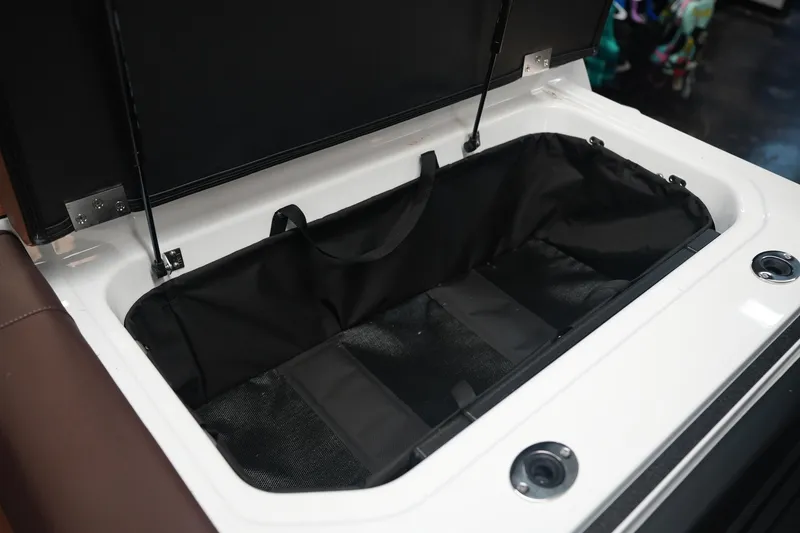 Slide: The Image of Open storage compartment in Moomba Craz 2026 boat. - 13