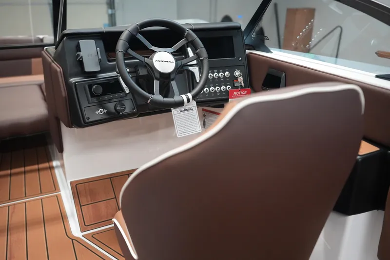 Slide: The Image of Interior of 2026 Moomba Craz with steering wheel and control console. - 16