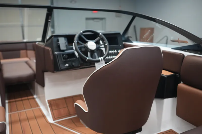 Slide: The Image of Interior of 2026 Moomba Craz with brown seats and steering wheel. - 17