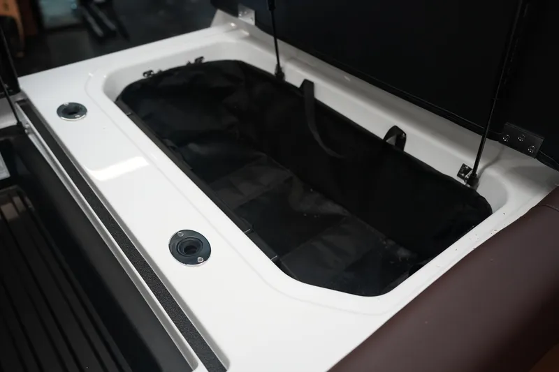 Slide: The Image of 2026 Moomba Craz boat storage compartment with open lid. - 18