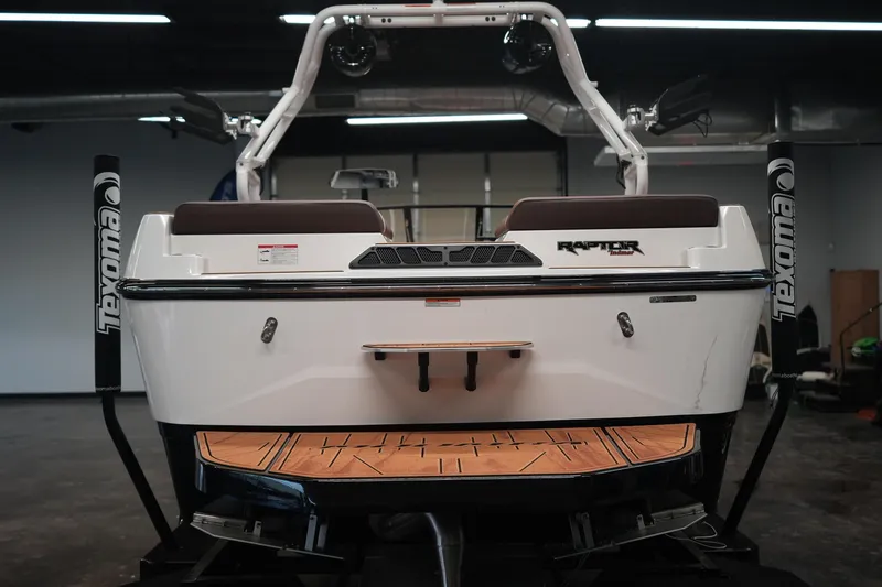 Slide: The Image of Rear view of 2026 Moomba Craz boat indoors. - 4