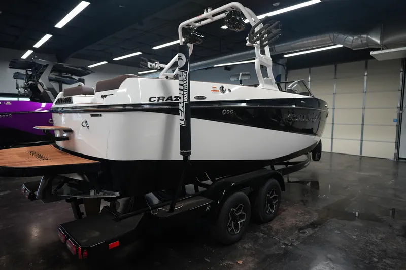 Slide: The Image of 2026 Moomba Craz boat in a showroom on a trailer. - 5