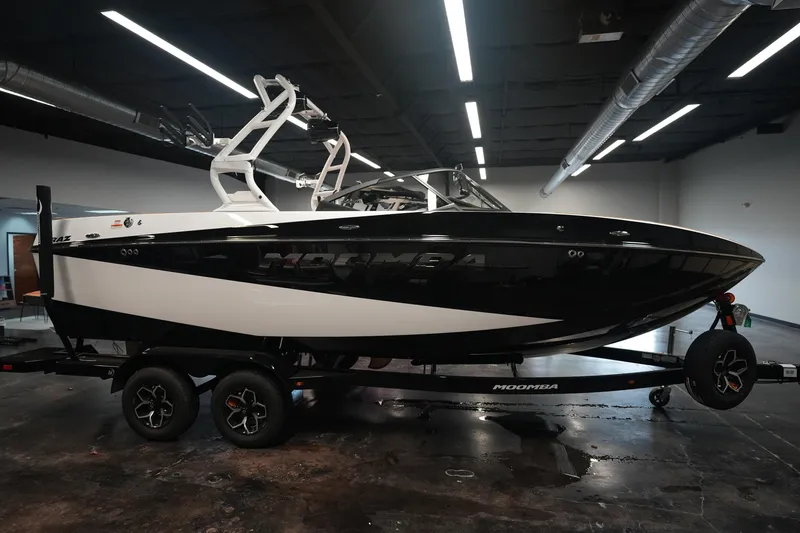 Slide: The Image of 2026 Moomba Craz boat indoors on a trailer. - 6