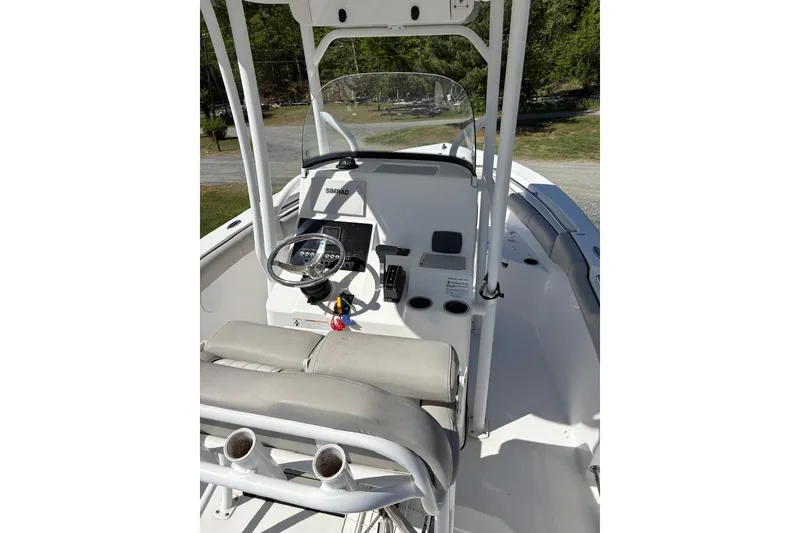 Slide: The Image of 2018 Sea Pro 219 Center Console boat interior with steering wheel and seating. - 11