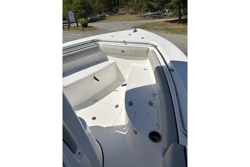Slide: The Image of 2018 Sea Pro 219 Center Console boat interior with seating and storage compartments. - 12