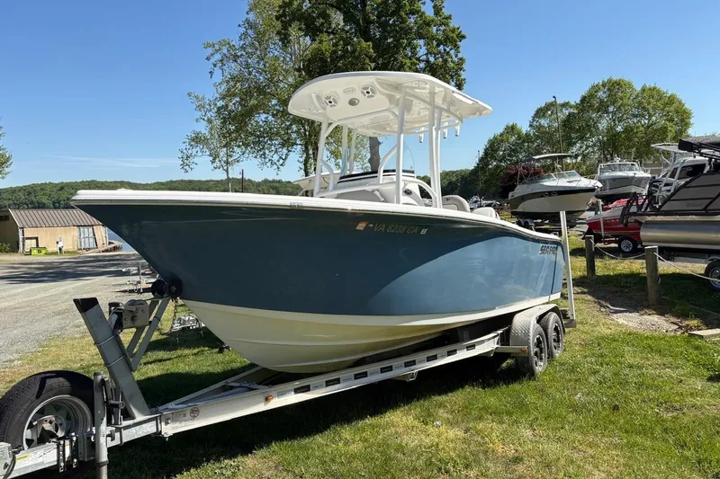 Slide: The Image of 2018 Sea Pro 219 Center Console boat on trailer, parked outdoors. - 3