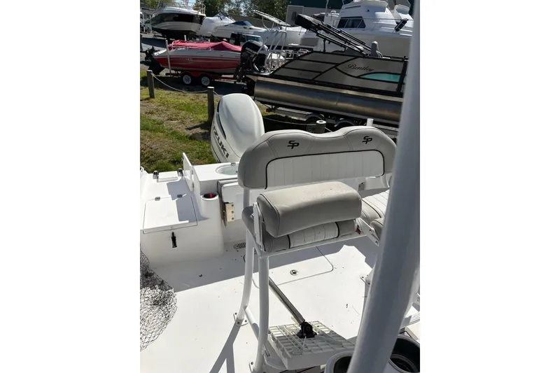 Slide: The Image of 2018 Sea Pro 219 Center Console boat with seating and Suzuki outboard motor. - 8