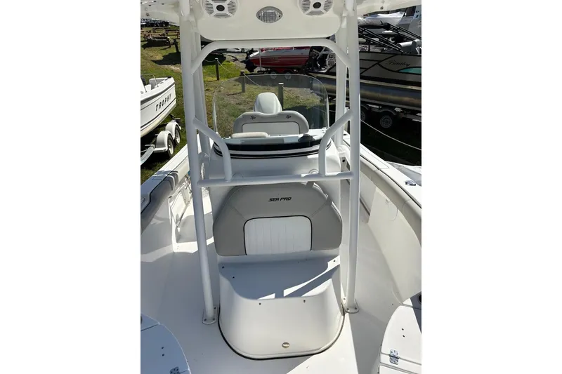 Slide: The Image of 2018 Sea Pro 219 Center Console boat interior with seating and console view. - 9