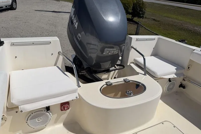 Slide: The Image of 2003 Sea Hunt Victory 215 boat with Yamaha 225 engine, featuring seating and storage. - 15