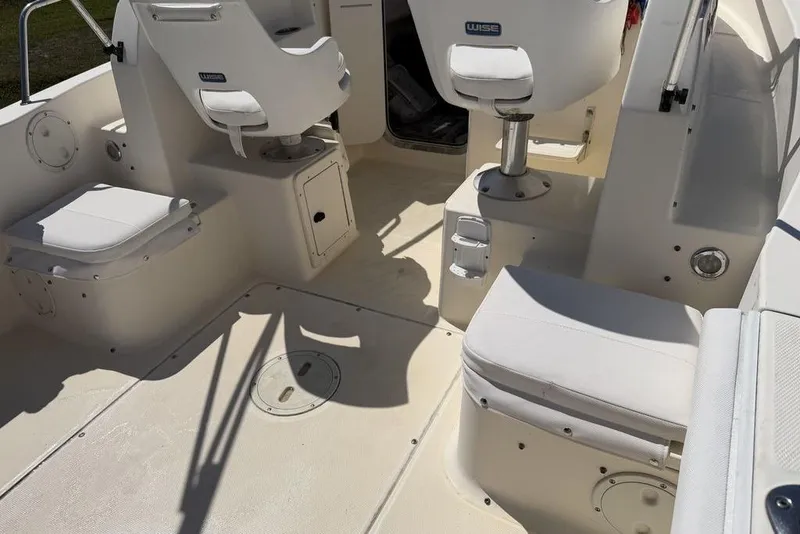 Slide: The Image of 2003 Sea Hunt Victory 215 boat interior with white seating and clean deck. - 17