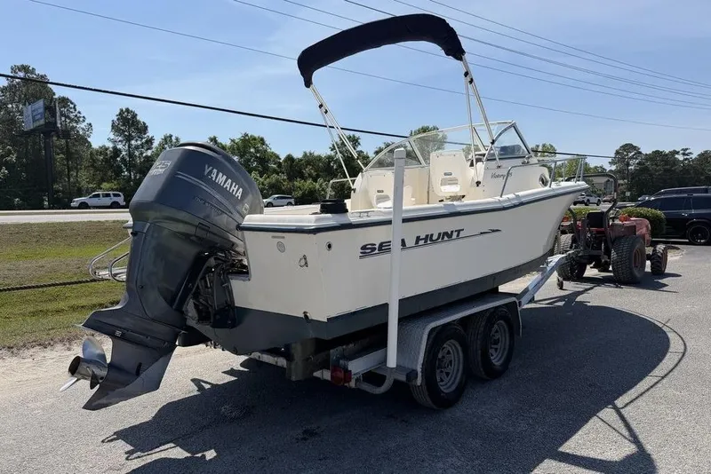Slide: The Image of 2003 Sea Hunt Victory 215 boat on trailer with Yamaha outboard motor. - 3