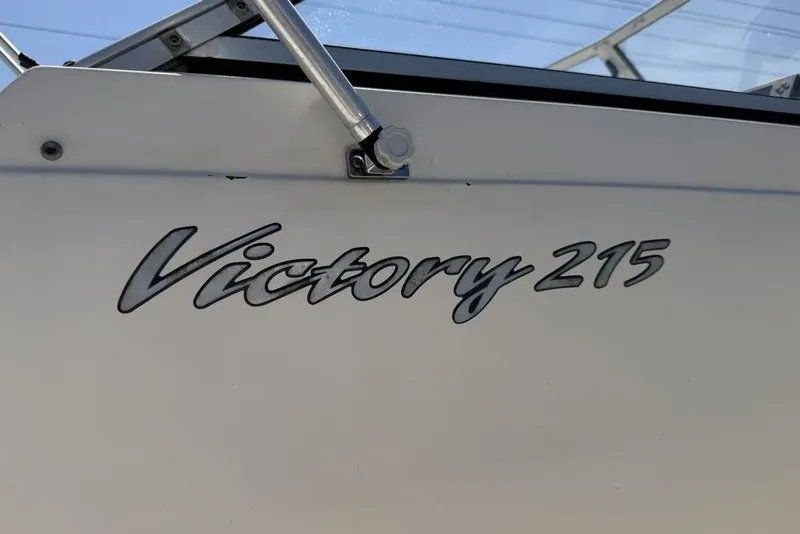 Slide: The Image of 2003 Sea Hunt Victory 215 boat logo on white surface. - 8