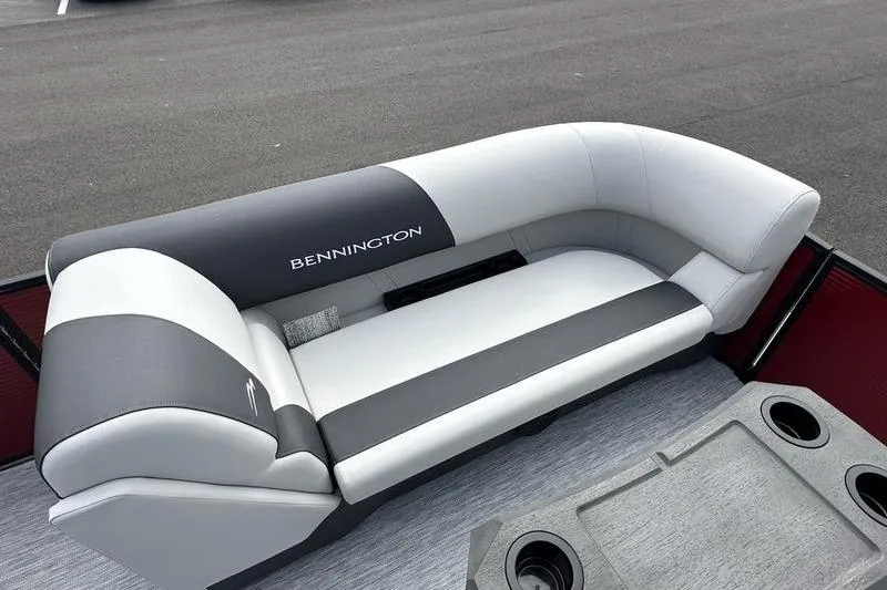 Slide: The Image of 2026 Bennington S Swingback 22 SSB boat seat, gray and white upholstery, cup holders visible. - 13