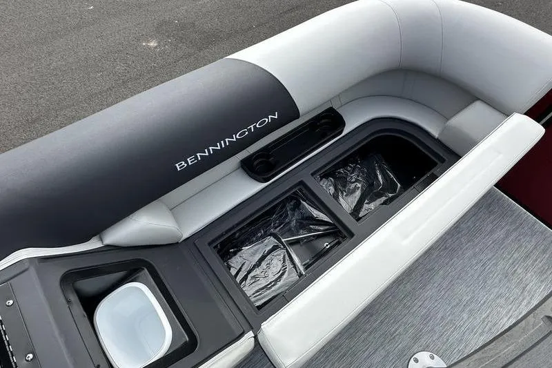 Slide: The Image of 2026 Bennington S Swingback 22 SSB boat interior with sleek seating and storage compartments. - 14