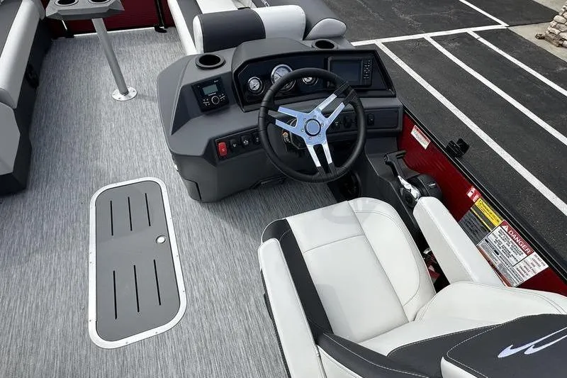 Slide: The Image of Interior of 2026 Bennington S Swingback 22 SSB boat with modern steering and seating. - 16