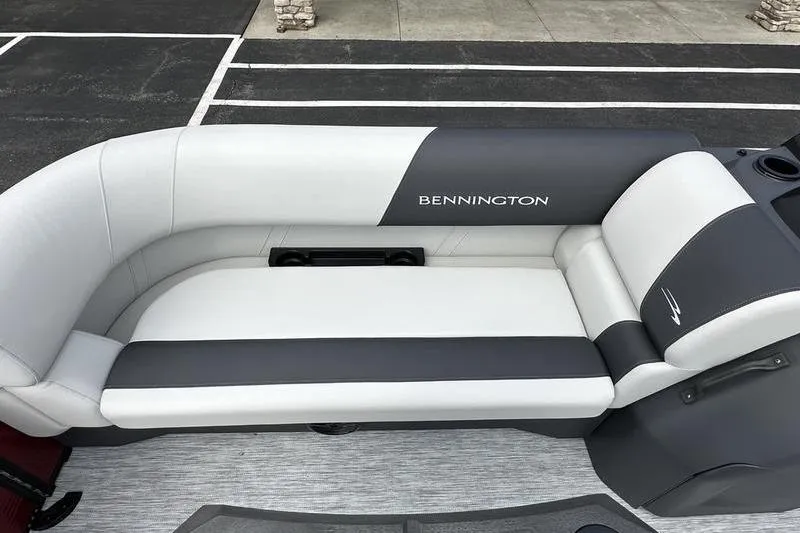 Slide: The Image of 2026 Bennington S Swingback 22 SSB boat seat, featuring sleek gray and white upholstery. - 19