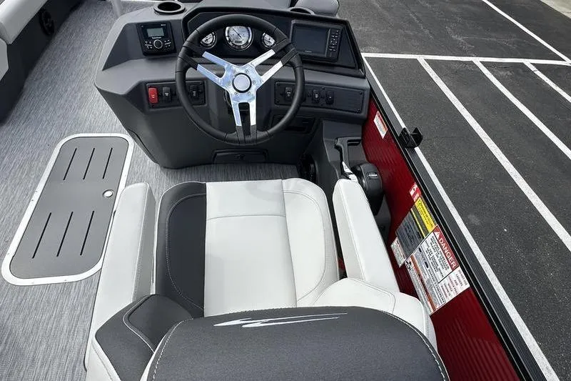 Slide: The Image of 2026 Bennington S Swingback 22 SSB boat cockpit with modern steering and controls. - 22
