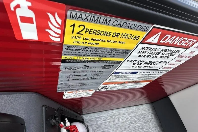 Slide: The Image of Safety and capacity labels on a 2026 Bennington S Swingback 22 SSB boat. - 26