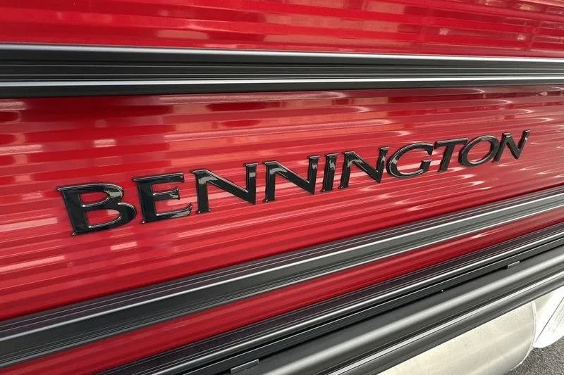 Slide: The Image of Close-up of 2026 Bennington S Swingback 22 SSB logo on red surface. - 28
