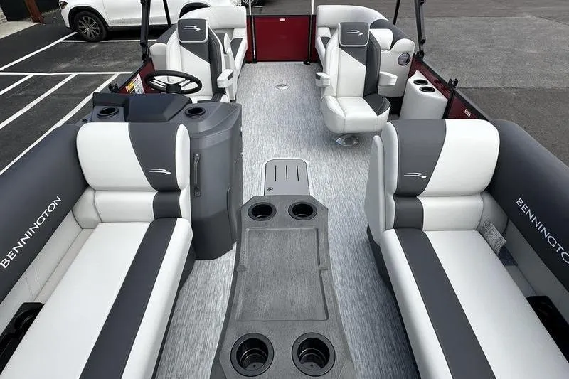 Slide: The Image of 2026 Bennington S Swingback 22 SSB pontoon boat interior with stylish seating and cup holders. - 5