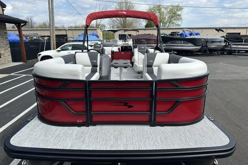 Slide: The Image of 2026 Bennington S Swingback 22 SSB pontoon boat with red and white seating. - 6