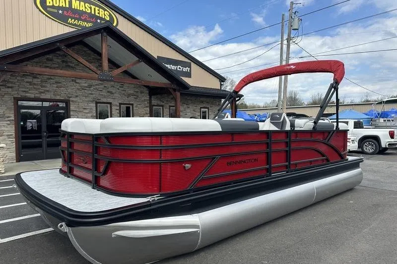 Slide: The Image of 2026 Bennington S Swingback 22 SSB pontoon boat in vibrant red at dealership. - 8