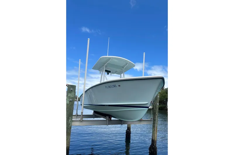 The Image of 2018 Albury Brothers 23 boat on lift, clear sky background. - 1
