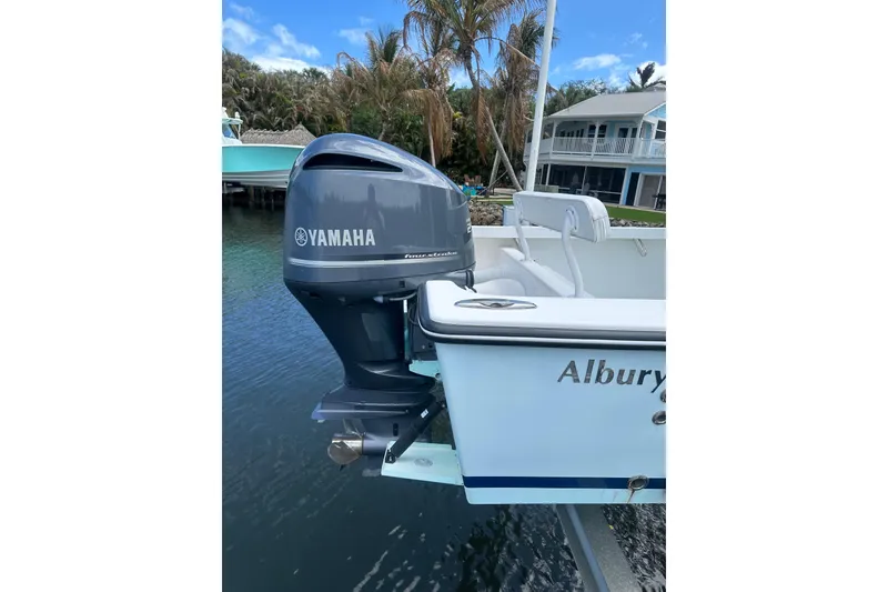 Slide: The Image of 2018 Albury Brothers 23 boat with Yamaha outboard motor docked by waterfront home. - 5