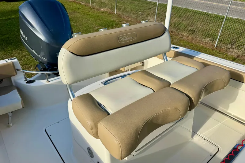 Slide: The Image of 2019 Pioneer 222 Sportfish boat seating with Yamaha engine in background. - 12