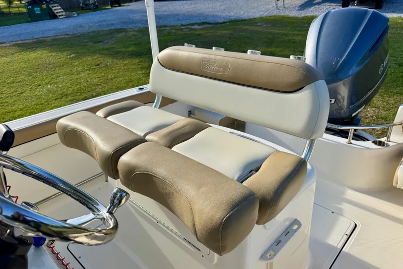 Slide: The Image of 2019 Pioneer 222 Sportfish boat seat with steering wheel and Yamaha engine. - 9