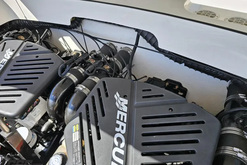 Slide: The Image of Engine compartment of a 2001 Powerquest 340 Vyper boat with Mercury components. - 100