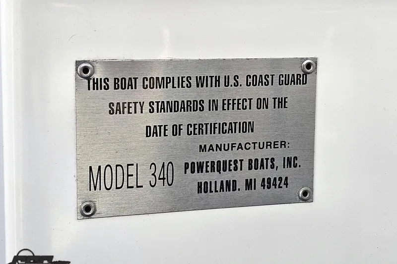 Slide: The Image of 2001 Powerquest 340 Vyper compliance plate with U.S. Coast Guard safety standards. - 105