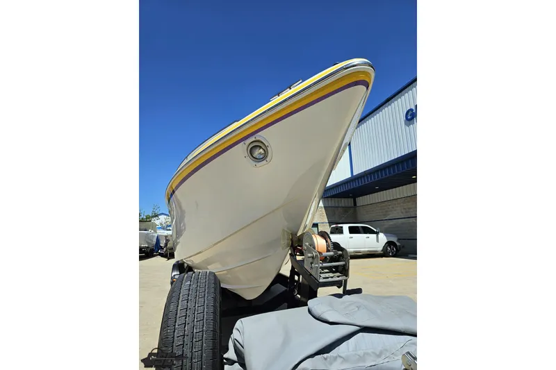 Slide: The Image of 2001 Powerquest 340 Vyper boat on trailer, viewed from the front, under clear blue sky. - 13