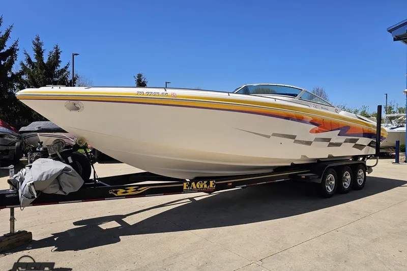 Slide: The Image of 2001 Powerquest 340 Vyper boat on trailer, vibrant graphics, sunny day. - 15
