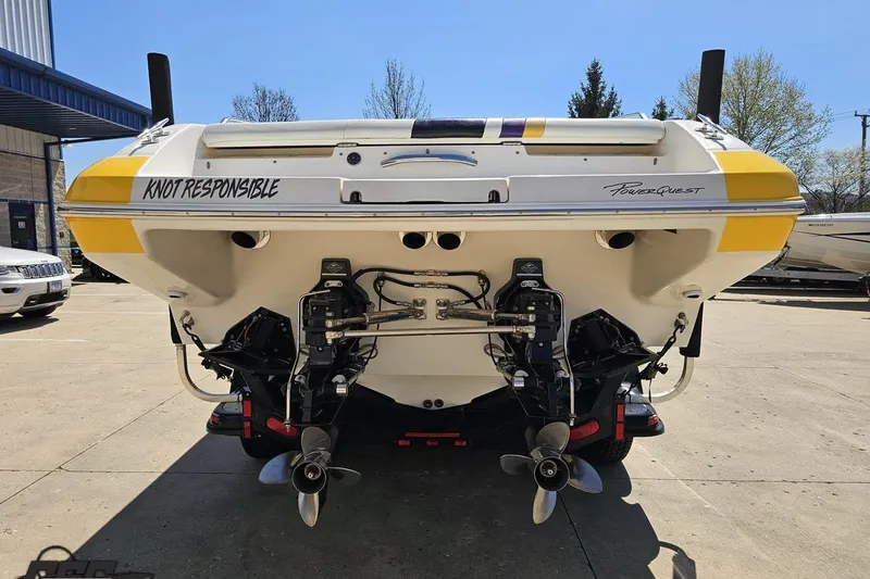 Slide: The Image of Rear view of a 2001 Powerquest 340 Vyper boat with dual propellers. - 23