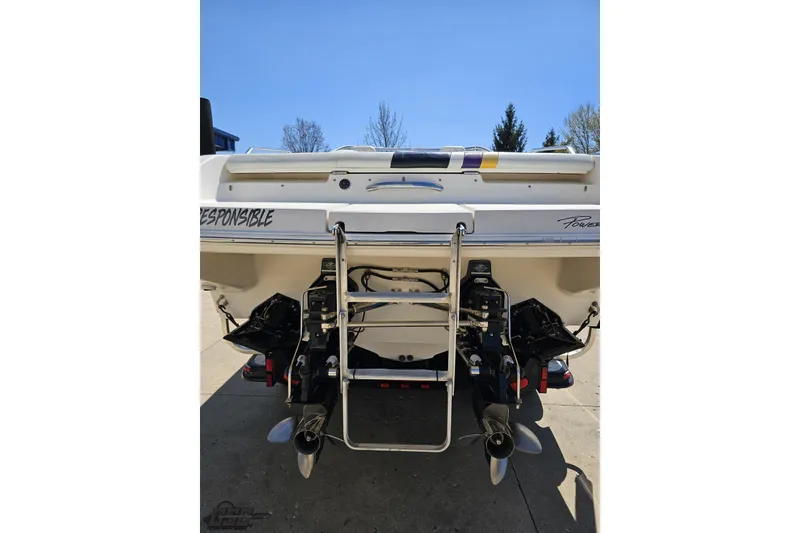 Slide: The Image of Rear view of 2001 Powerquest 340 Vyper boat with dual propellers and ladder. - 26