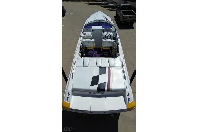 Slide: The Image of 2001 Powerquest 340 Vyper speedboat, aerial view, white with colorful accents, docked. - 29