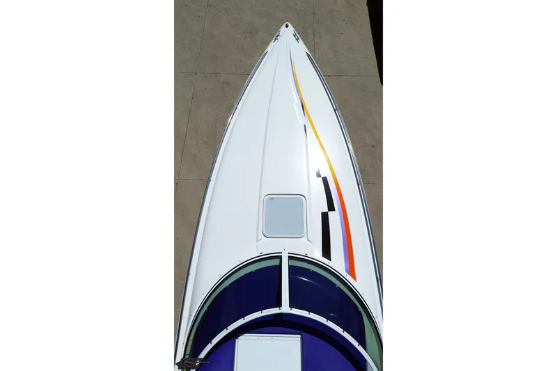 Slide: The Image of Top view of a 2001 Powerquest 340 Vyper boat with colorful stripes. - 32
