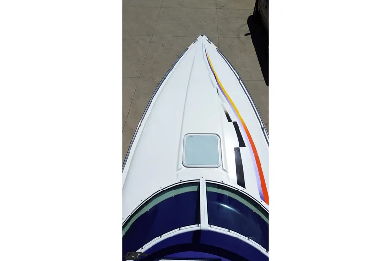 Slide: The Image of Top view of 2001 Powerquest 340 Vyper boat with colorful stripes. - 33