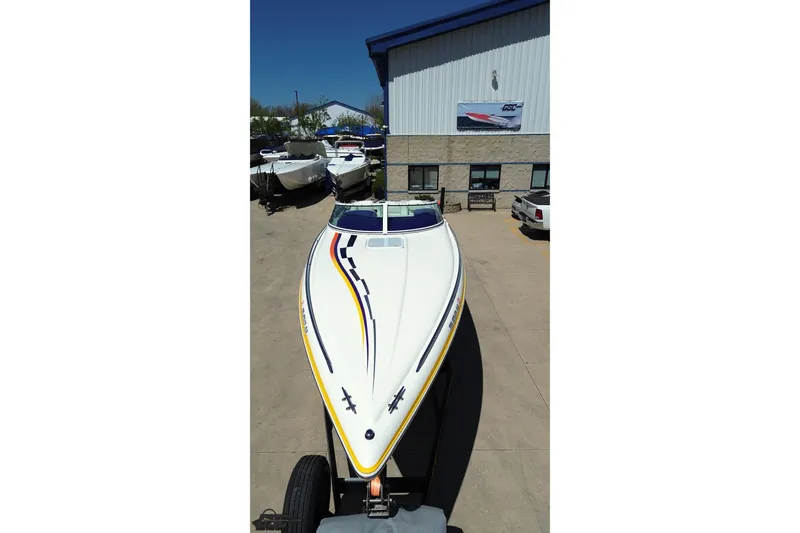 Slide: The Image of 2001 Powerquest 340 Vyper boat with sleek design, parked outdoors. - 34