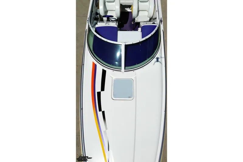 Slide: The Image of Top view of a 2001 Powerquest 340 Vyper boat with colorful stripes. - 36