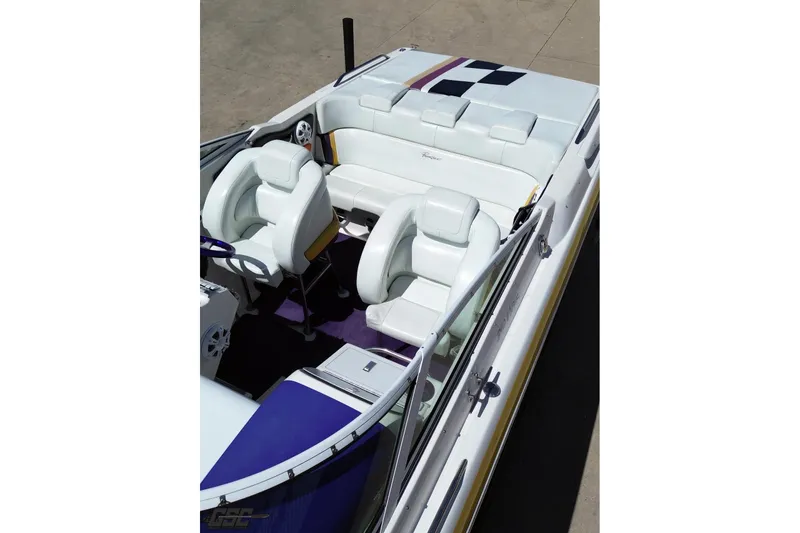 Slide: The Image of 2001 Powerquest 340 Vyper boat interior with white seating and purple accents. - 38