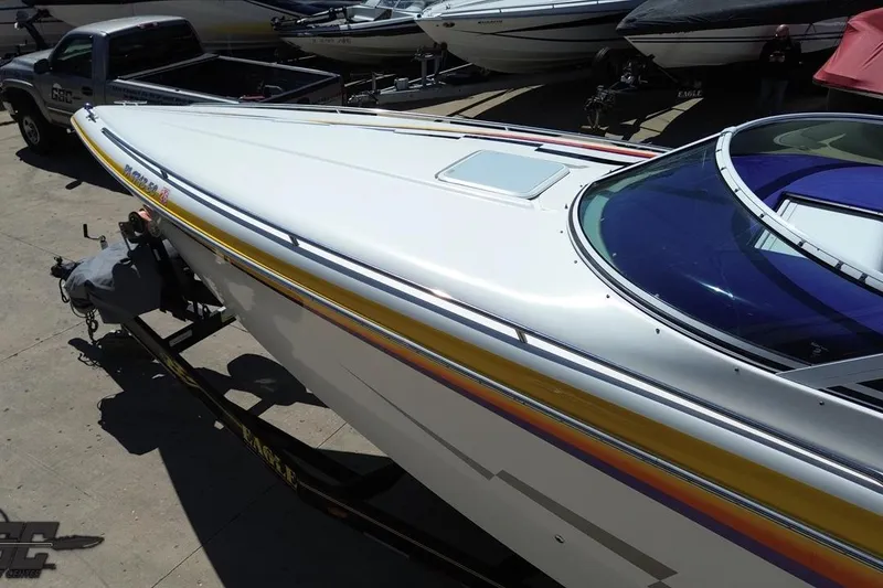 Slide: The Image of 2001 Powerquest 340 Vyper boat on trailer, sleek design with vibrant accents. - 42