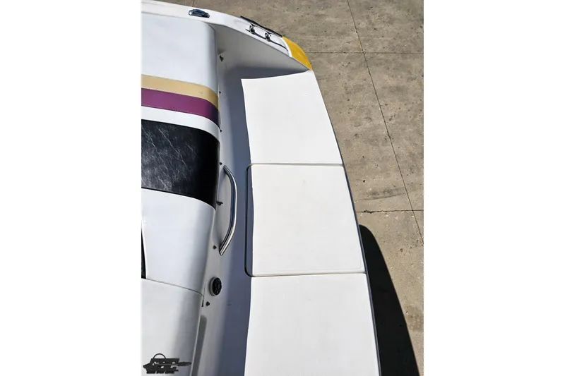 Slide: The Image of 2001 Powerquest 340 Vyper boat deck with colorful accents and sleek design. - 44